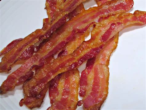 Bacon bacon - The Salty, Crunchy Truth. Bacon is a pork or turkey product made by soaking the meat in a salty solution containing nitrates and sometimes sugar before smoking it. Processed meats may be ...